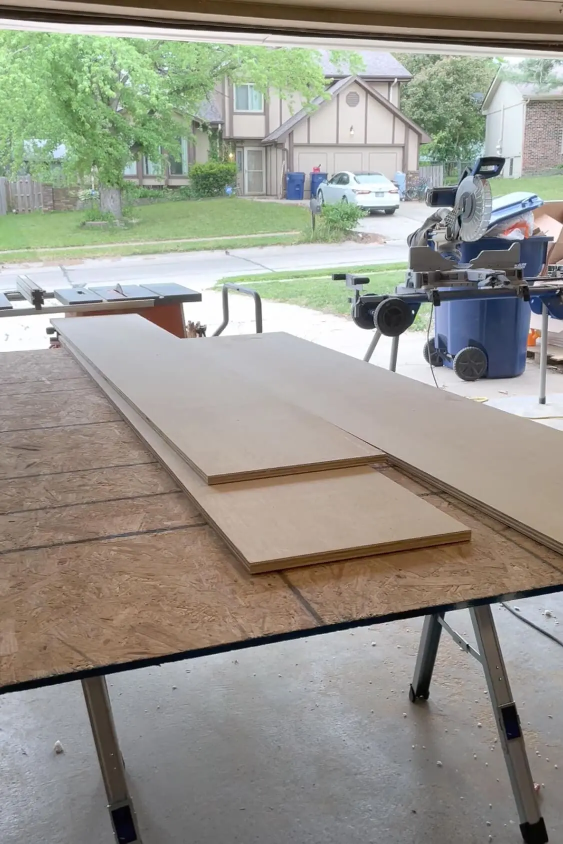 Pieces of wood for building DIY pantry shelves.